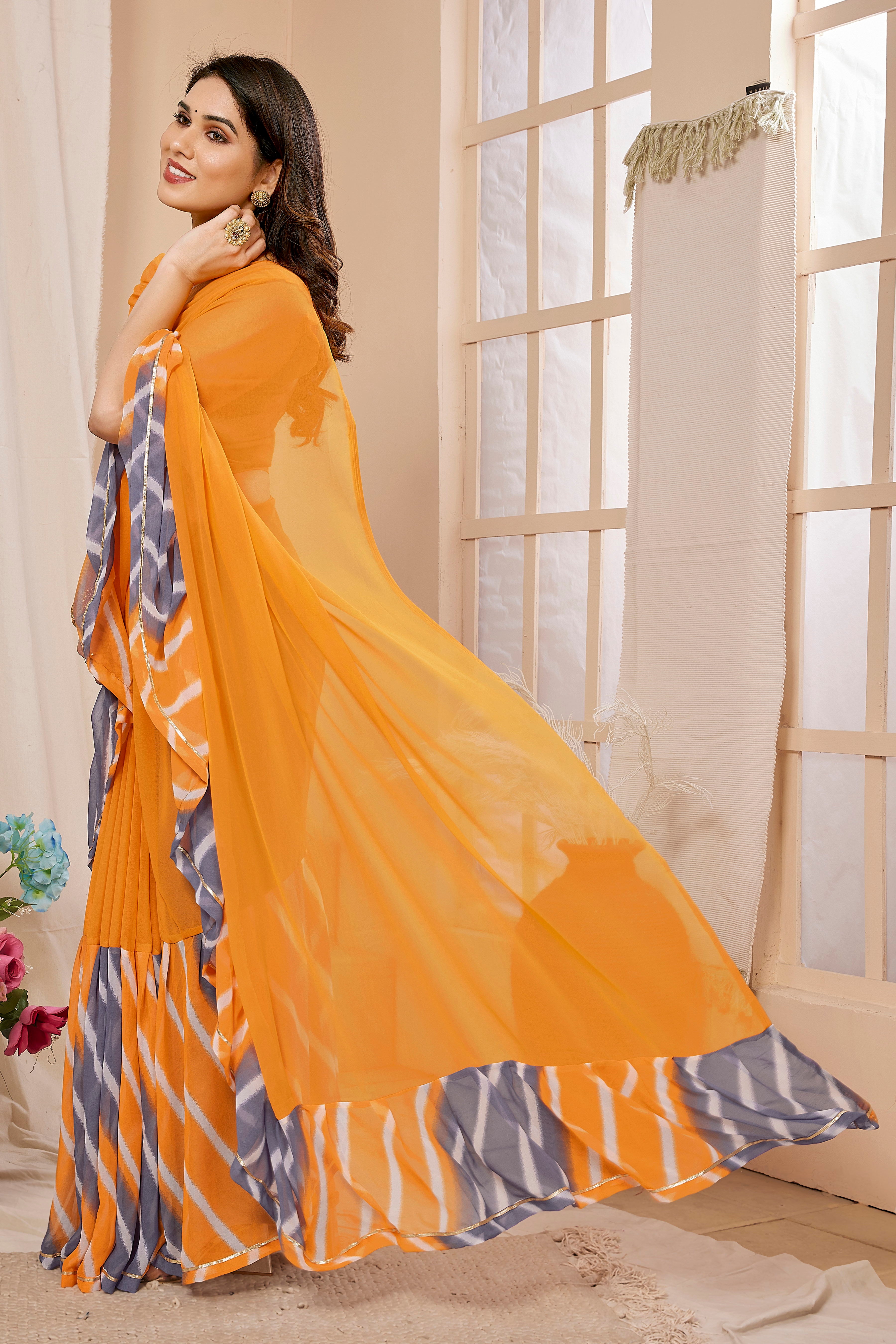 Vsaree Orange Ruffal Georgette Saree And Designer Border With Heavy Rich Pallu